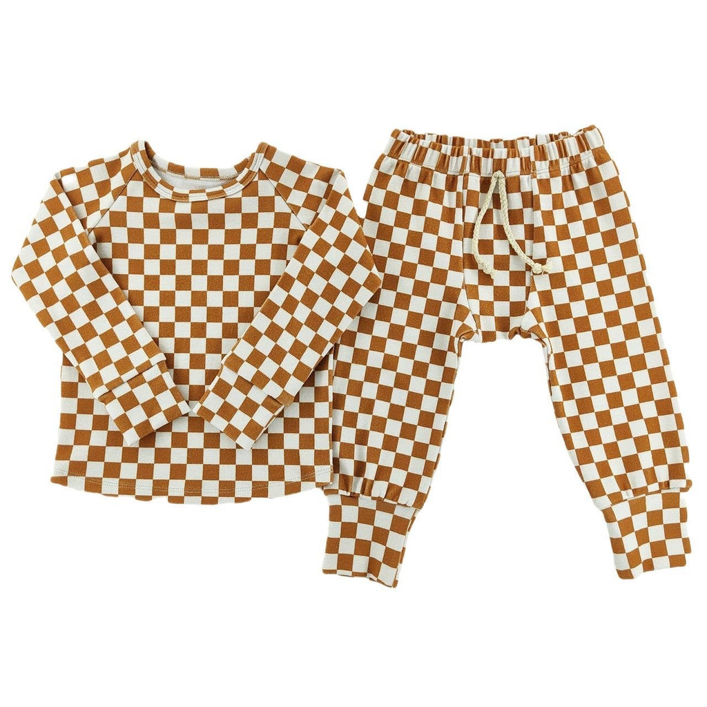 Brown and white checkered pajama set on a white background